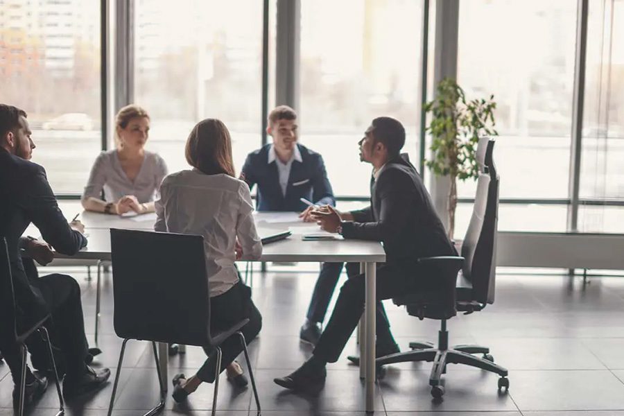 General Liability Insurance - Manager Leads Personnel Meeting with Business Colleagues and Brainstorms Together in a Conference Room of a Modern Office with Large Windows